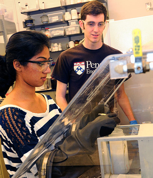 REU Student working in glove box.