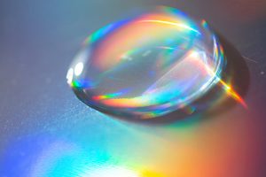 Extreme close up of water drop on the hologram color paper