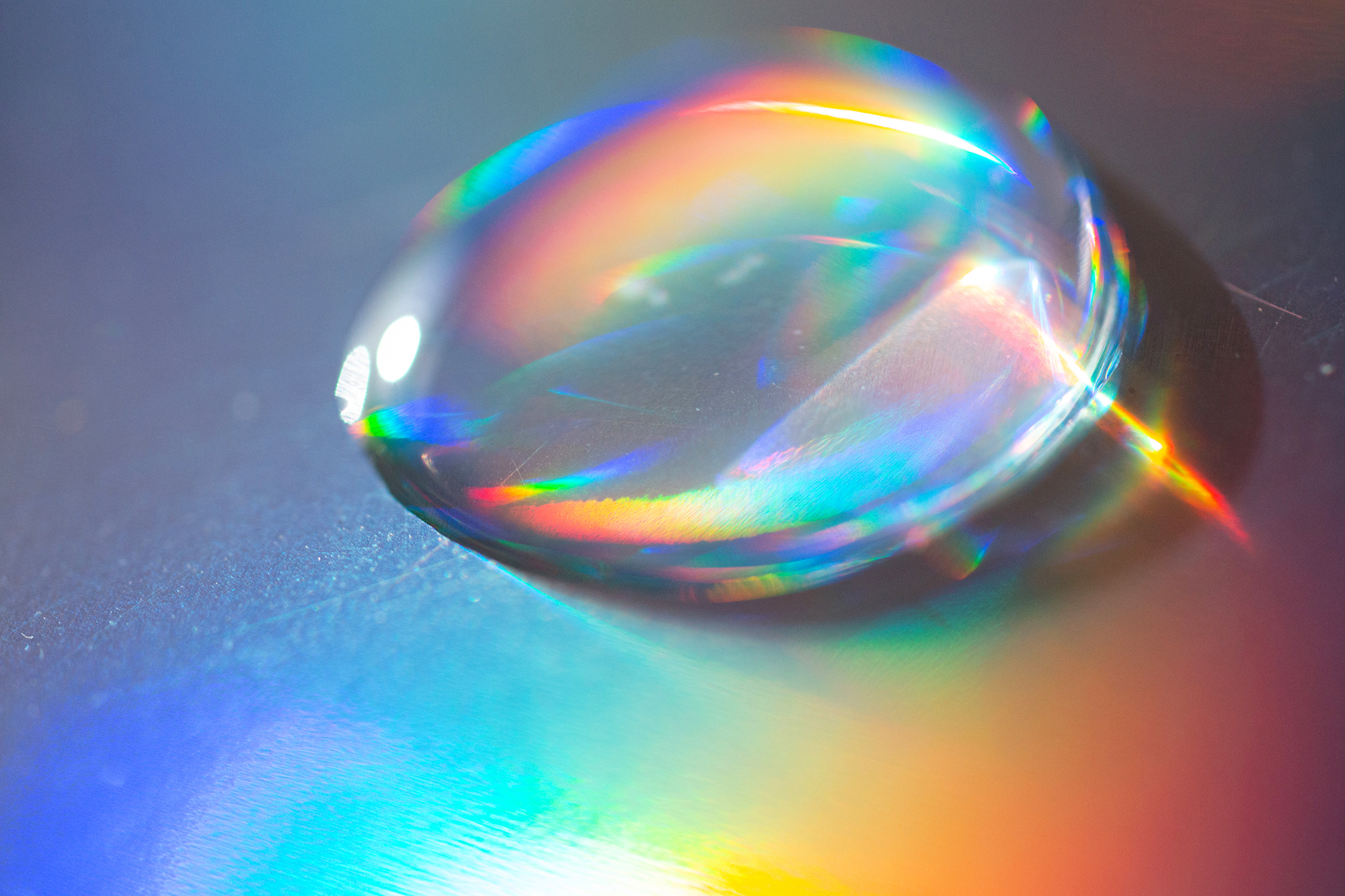 Extreme close up of water drop on the hologram color paper